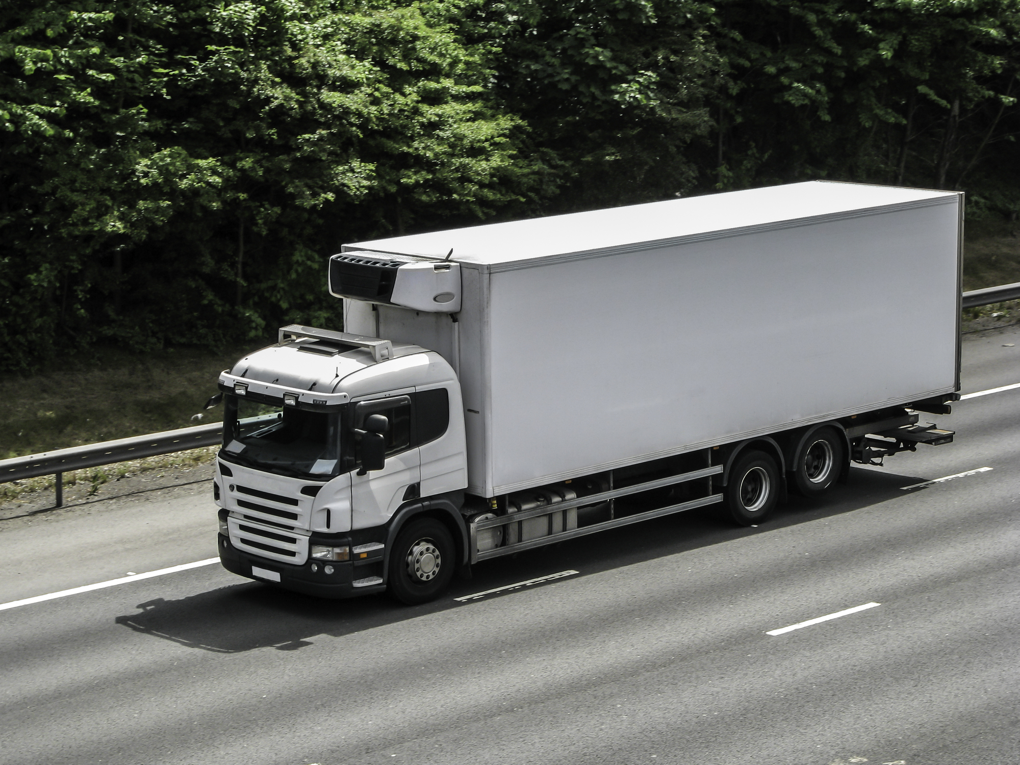 White short lorry on the motorway.